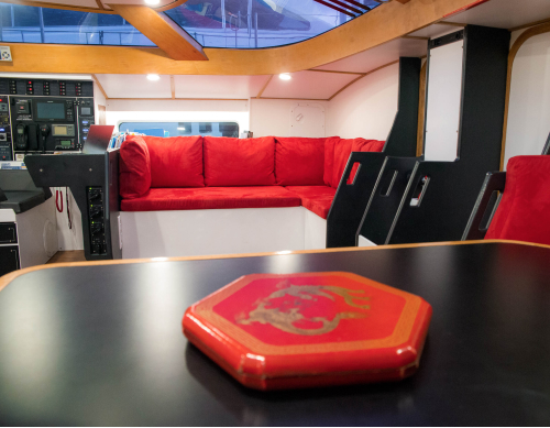 To port, near the Captain's Chart Table, a comfortable sofa awaits you for reading, chatting, or simply admiring the scenery.